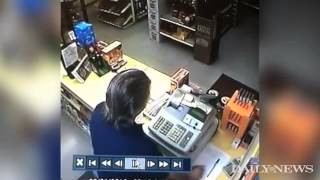 Robber pulls gun liquor store clerk is faster [upl. by Euginimod]